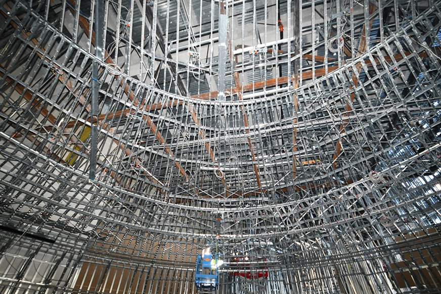 Ceiling installation in progress of exterior panels – Photo courtesy of Radius Track Ceiling installation in progress of exterior panels – Photo courtesy of Radius Track