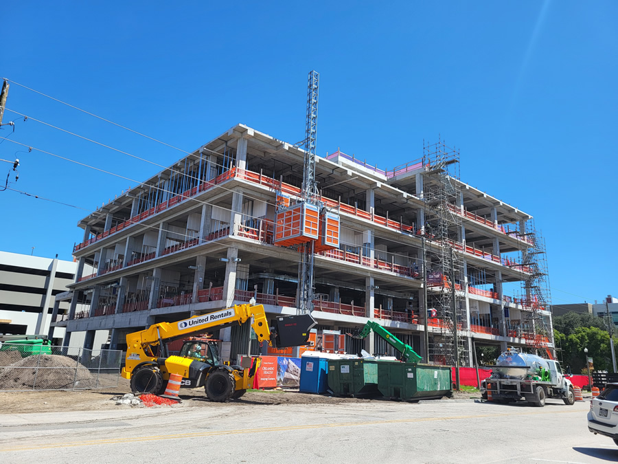 Image 1: Photo of the project prior to erection of the CFS curtain wall system. Interior framing, drywall and MEP installation are visible. The image highlights the urgency of completing the building shell to reduce exposed weather risk in coastal Florida. Courtesy of KENPAT.